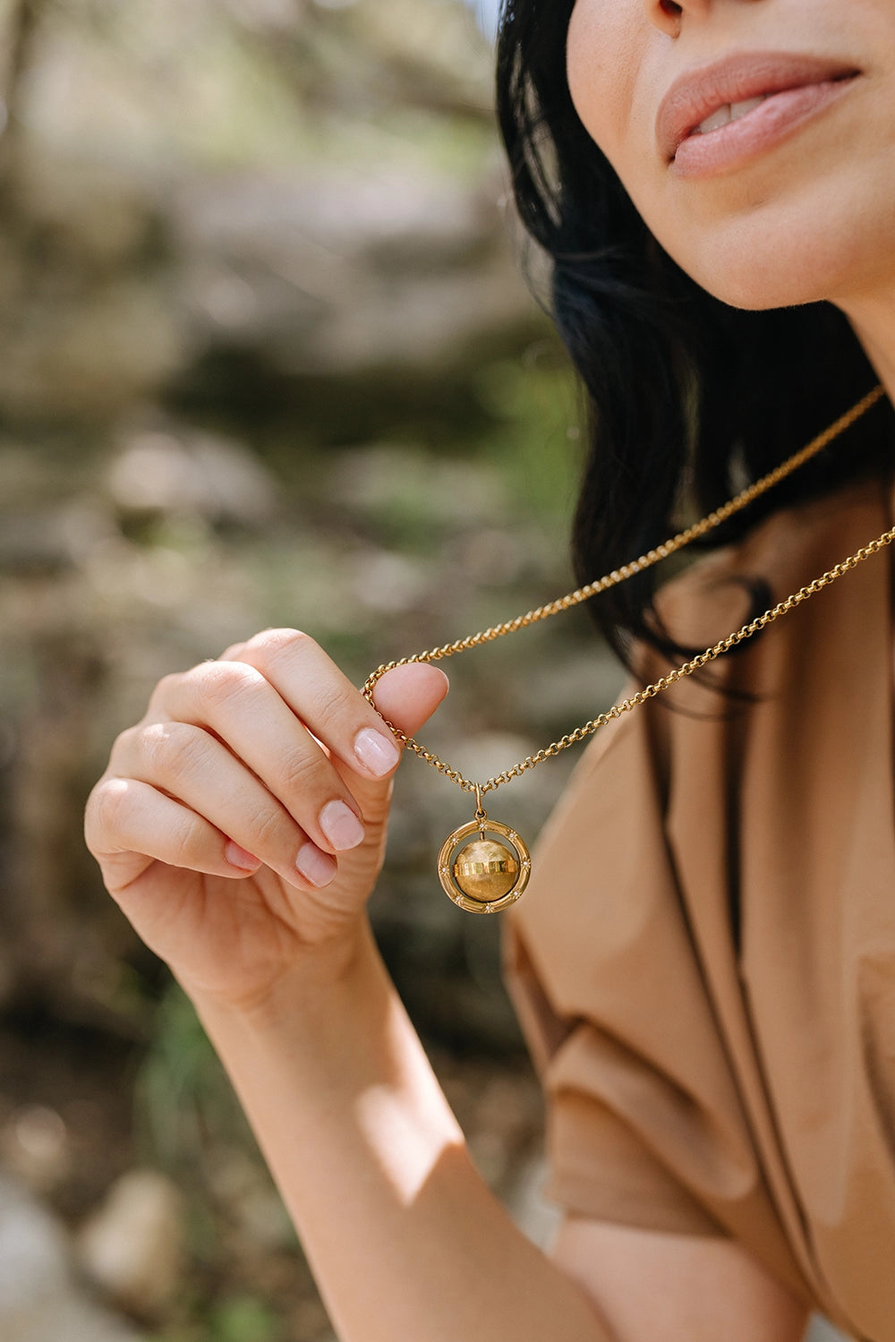 Love Makes The World Go Round Pendant
